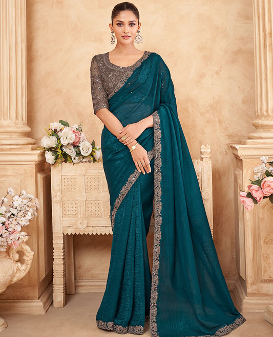 Peacock blue crushed designer saree, contrast paisley scallop embroidered border, and contrast embroidered blouse