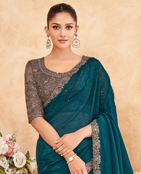 Peacock blue crushed designer saree, contrast paisley scallop embroidered border, and contrast embroidered blouse