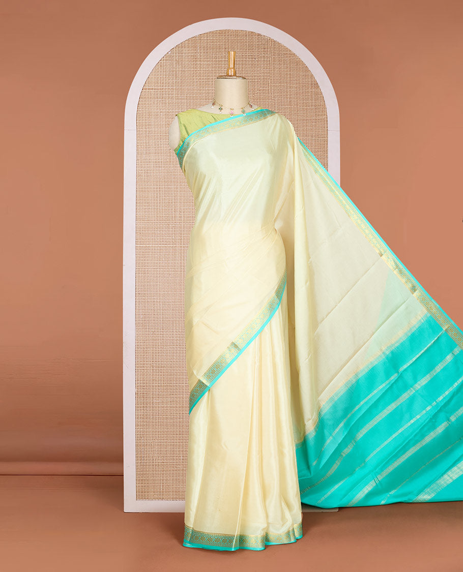 Pale yellow plain Mysore silk saree, contrast floral design zari border & pallu of zari stripes