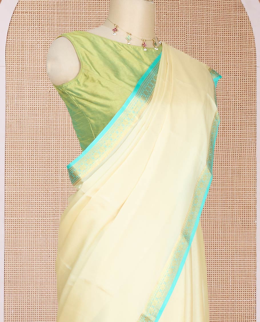 Pale yellow plain Mysore silk saree, contrast floral design zari border & pallu of zari stripes