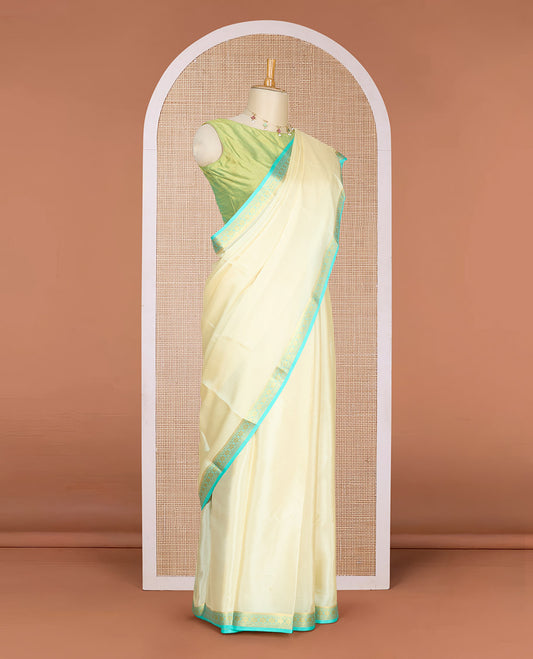 Pale yellow plain Mysore silk saree, contrast floral design zari border & pallu of zari stripes