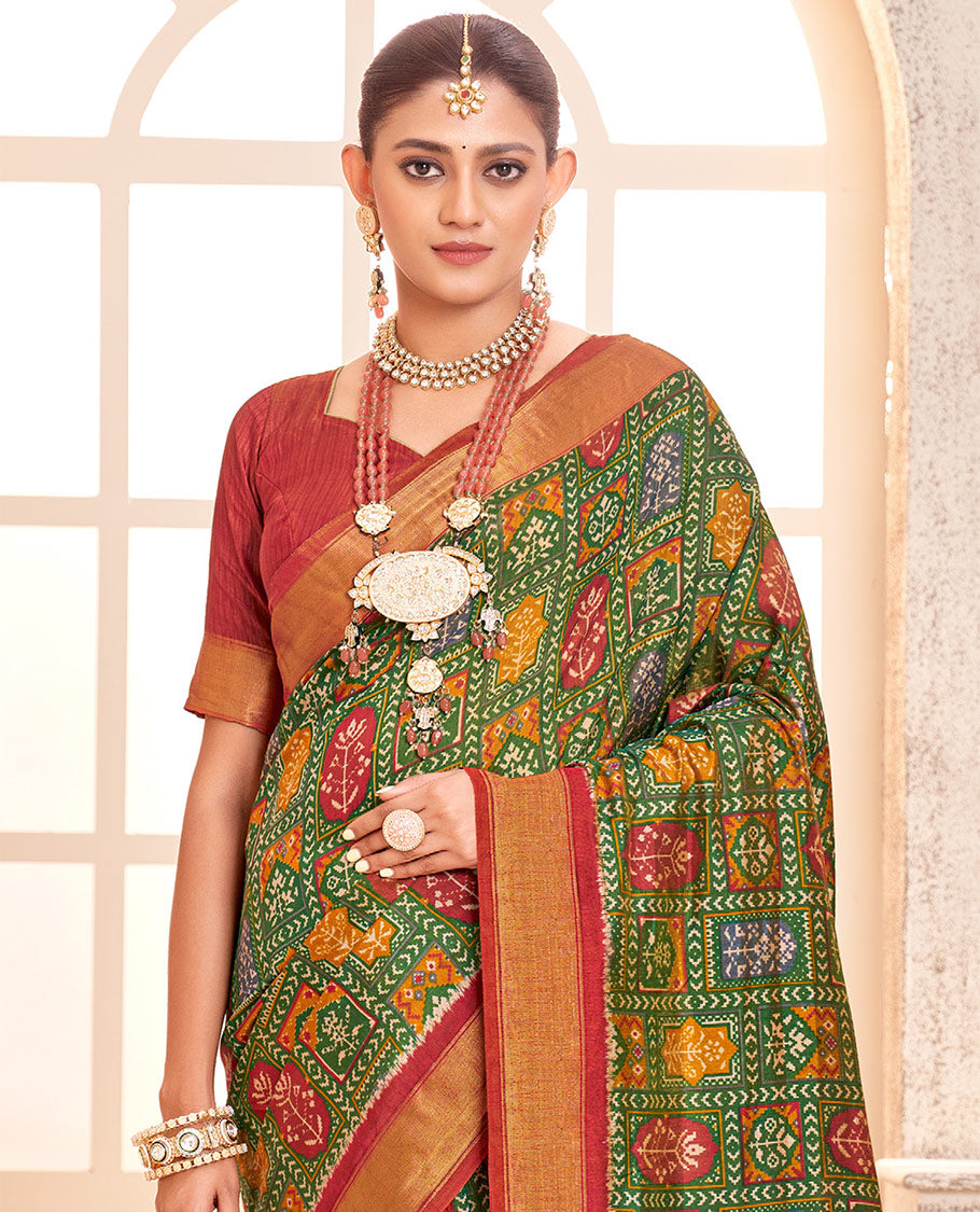 Green Patola Fancy Raw Silk Designer Saree, Bedecked with Intricate Design, a Bavanji Border, Intricately Designed Pallu, and a Contrast Blouse
