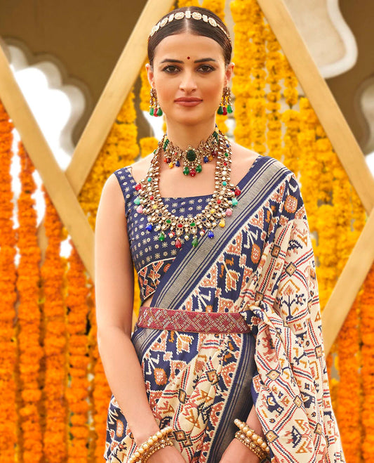 Light purple base butta enclosed jaal patola printed designer saree, contrast ikkat border, and floral ikkat design pallu