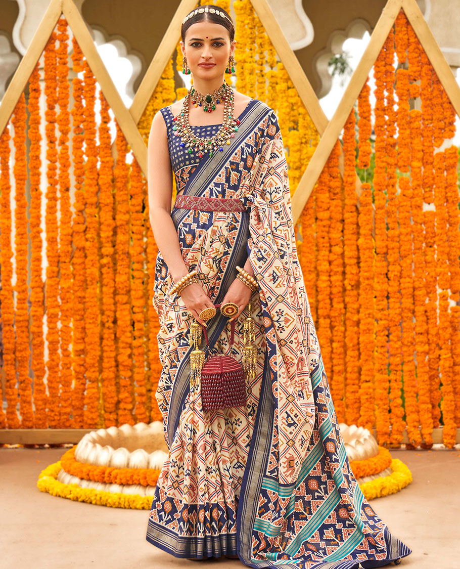 Sandal base butta enclosed jaal patola printed designer saree, contrast ikkat border, and floral ikkat design pallu