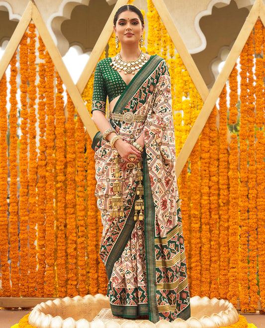 Light sandal base butta enclosed jaal patola printed designer saree, contrast ikkat border, and floral ikkat design pallu