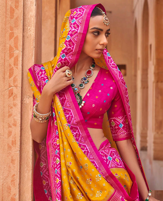 Orange Ikat Patola Designer Saree, Elevated with Floral Ikat Buttas, Complemented by a Contrast Ikat Border, Intricate Pallu, and a Contrast Blouse