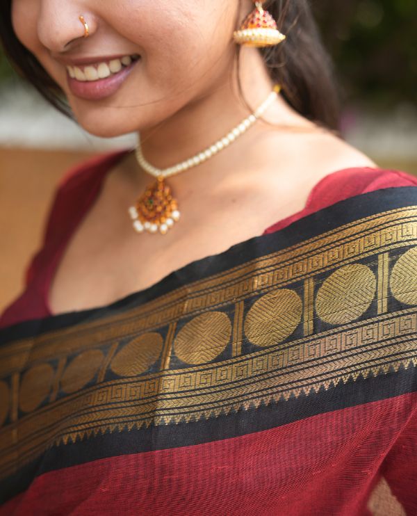 Maroon Plain Chettinad Cotton Saree, Complemented by a Contrast Rudraksham Design Traditional Zari  Border, Subtly Striped Pallu, and Paired with a Matching Blouse