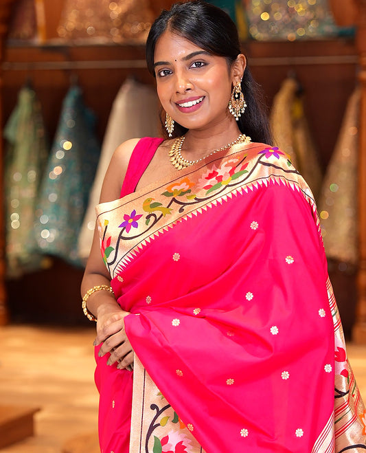 Red Paithani Art Silk Saree, Ornamented with Flower Buttas All Over Its Body, Highlighted by Zari Border Pictures Colorful Floral, and Parrot Designs, Pallu of Muniya, Floral and Parrot Designs, and Paired with a Matching Blouse