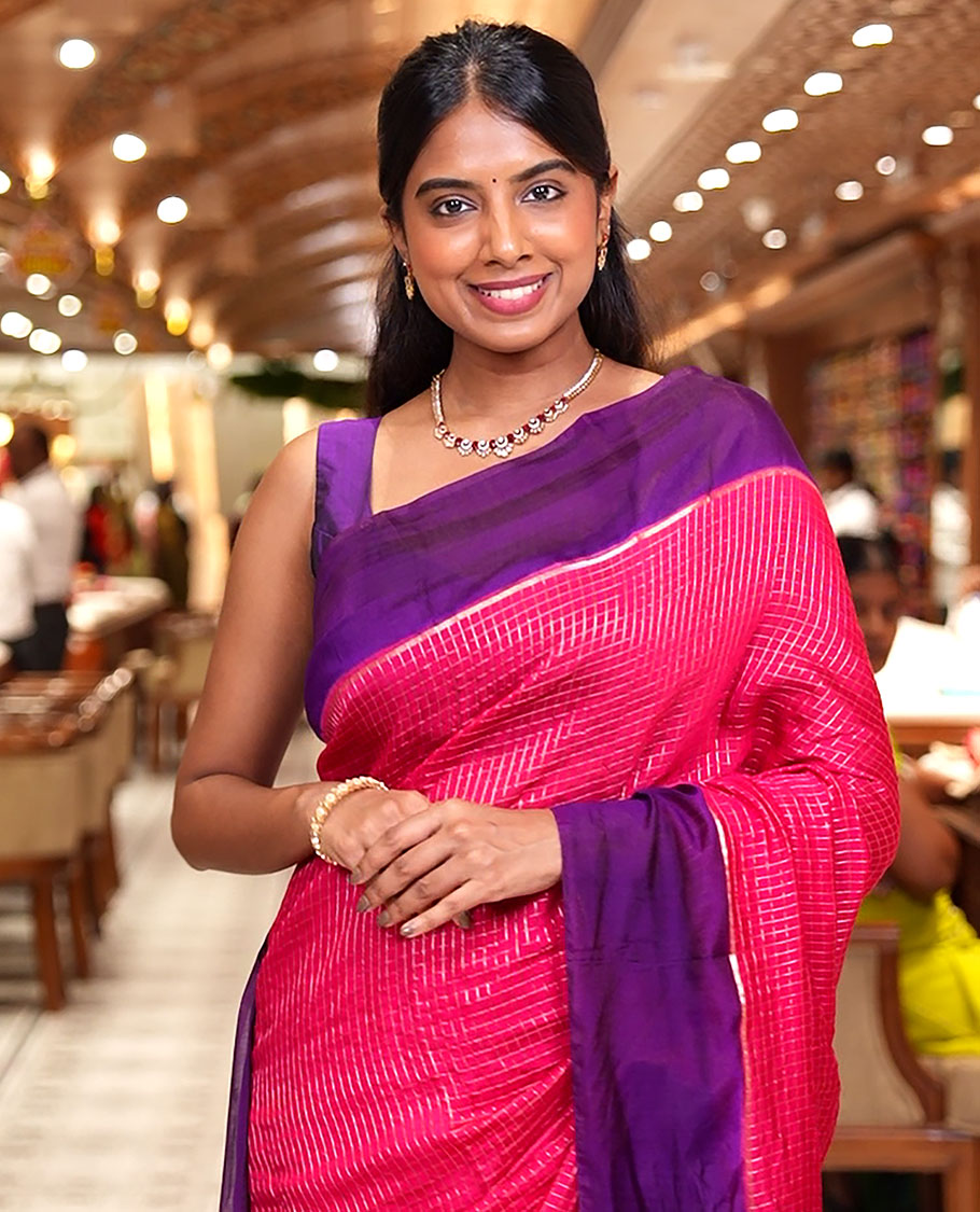 Pink Assam Silk Saree, Gleamed Up with Zari Checked Design on Its Body, Complemented by Contrast Border, Pallu Steeped with Gleaming Zari Stripes, and Paired with a Contrast Blouse