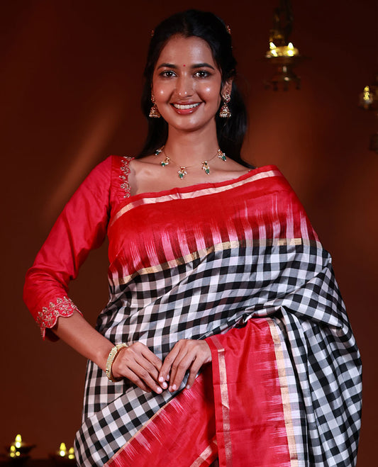 Black and white checked silk saree, contrast rettai pettu zari striped border, and pallu of geometric designs
