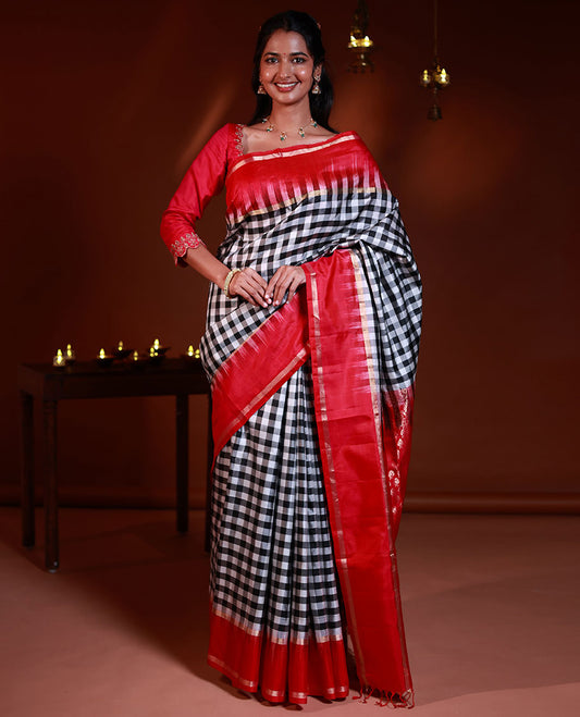 Black and white checked silk saree, contrast rettai pettu zari striped border, and pallu of geometric designs
