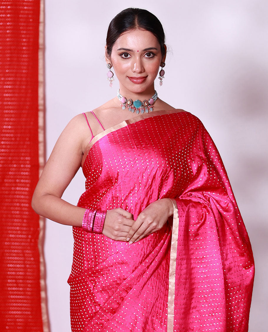 Bright pink dobbly style dotted banarasi silk saree, piping zari border, and chevron striped pallu