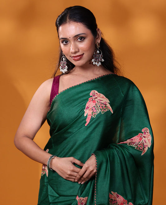 Borderless dark green macaw parrot motifs multi-colored thread embroidered tussar saree