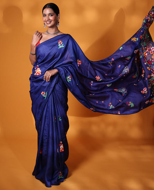Borderless ink blue base tussar saree with kaleidoscopic-colored thread floral embroidery motifs