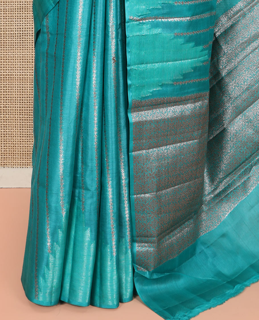 Borderless Green Tussar Silk Saree, Adorned With Zari Stripes All Over Its Body, Highlighted by Self-Pallu and Paired with a Matching Blouse