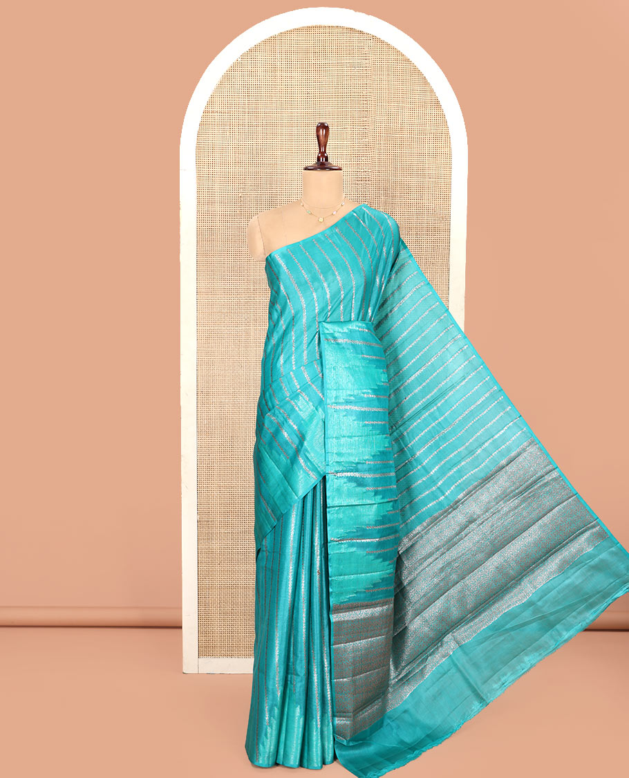 Borderless Green Tussar Silk Saree, Adorned With Zari Stripes All Over Its Body, Highlighted by Self-Pallu and Paired with a Matching Blouse