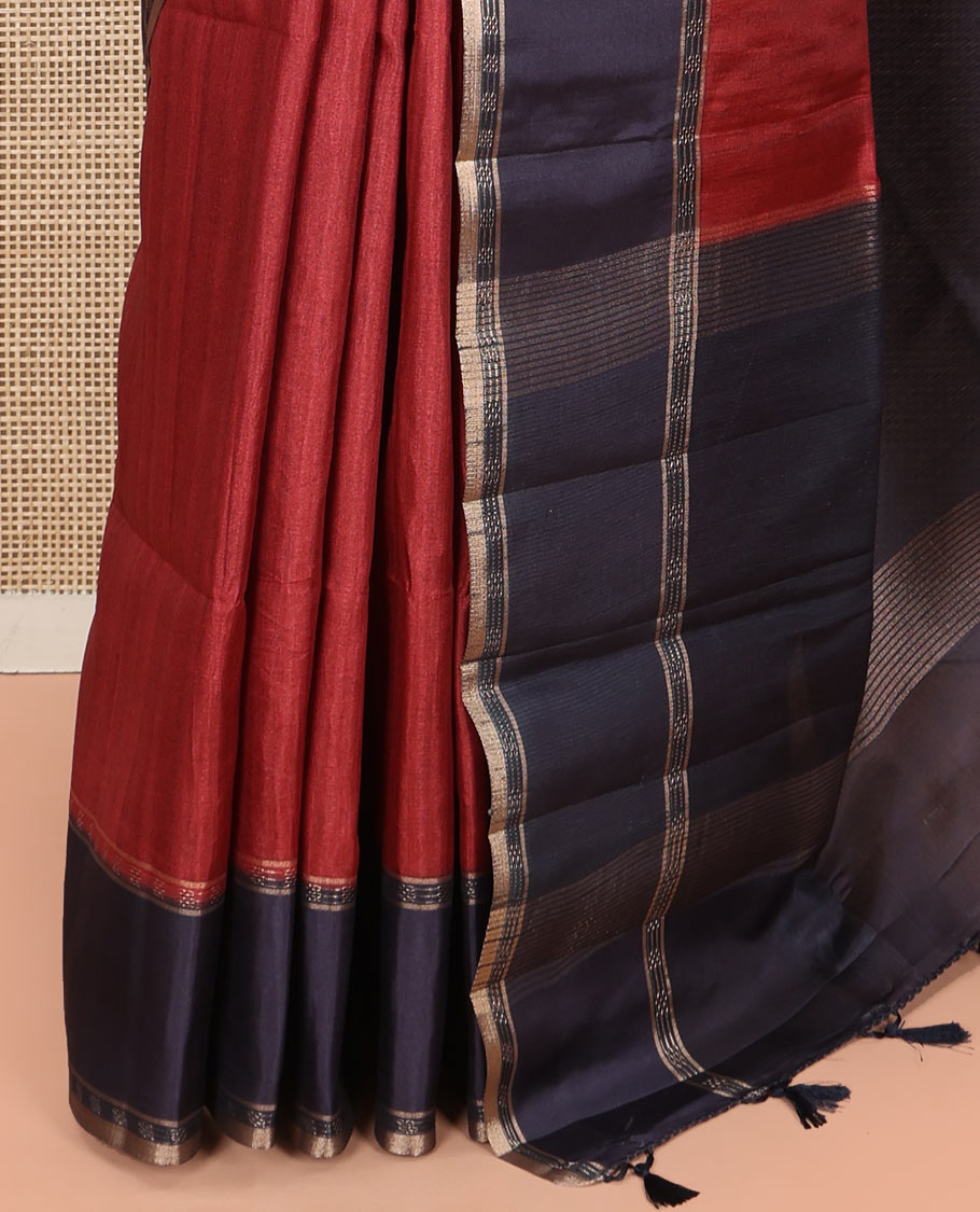 Maroon Plain Semi-Tussar Silk Saree, Complemented by a Contrast Geometric Design Border, Subtly Zari Striped Pallu, and Paired with a Contrast Floral Vine Printed Blouse