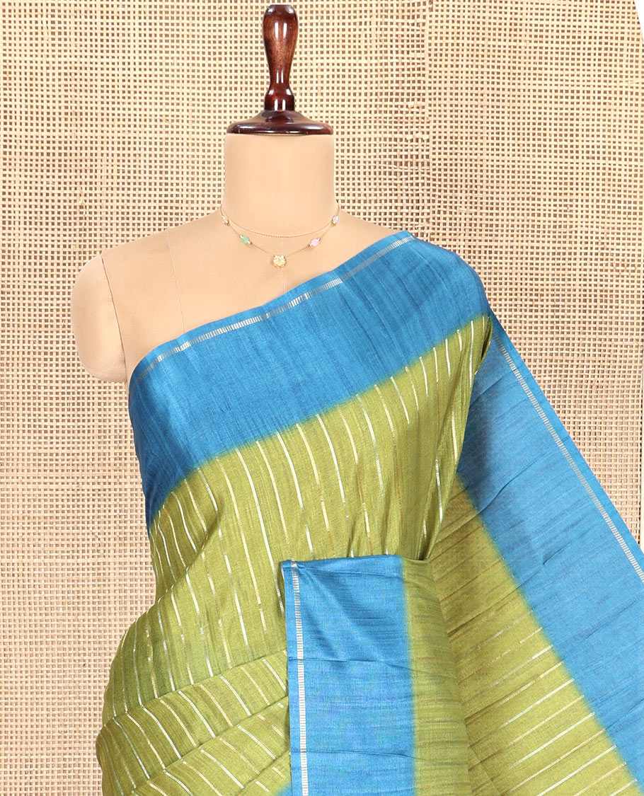 Pista Green Fancy Tussar Saree, Highlighted by Vertical Zari Stripes Across Its Body, Complemented by Captivating Contrast Geometric Patterned Border, Subtle Pallu and Paired with a Contrast Blouse