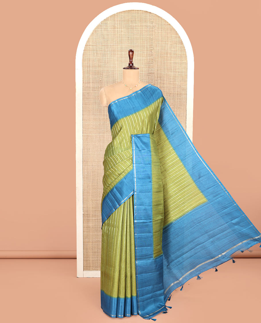 Pista Green Fancy Tussar Saree, Highlighted by Vertical Zari Stripes Across Its Body, Complemented by Captivating Contrast Geometric Patterned Border, Subtle Pallu and Paired with a Contrast Blouse