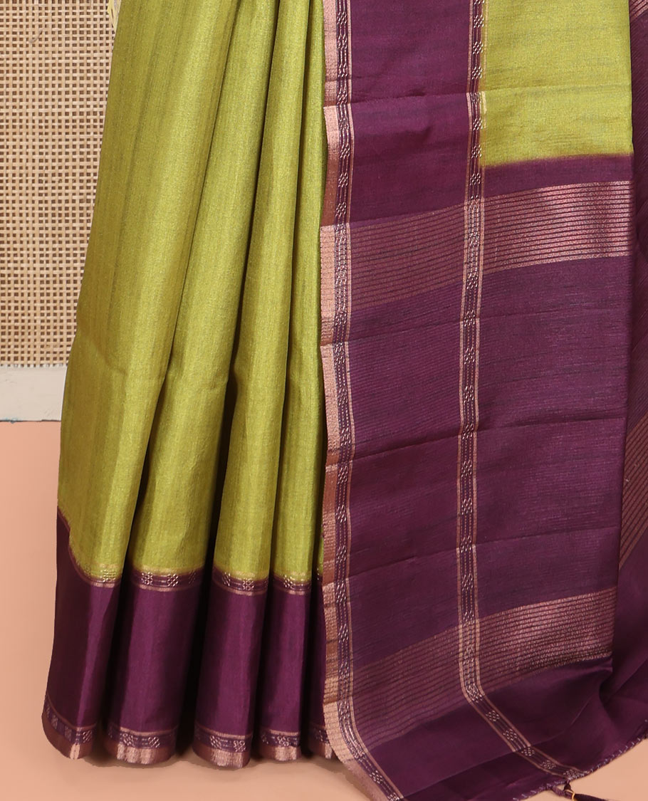 Olive Green Plain Semi-Tussar Silk Saree, Complemented by a Contrast Geometric Design Border, Subtly Zari Striped Pallu, and Paired with a Contrast Patola Printed Blouse