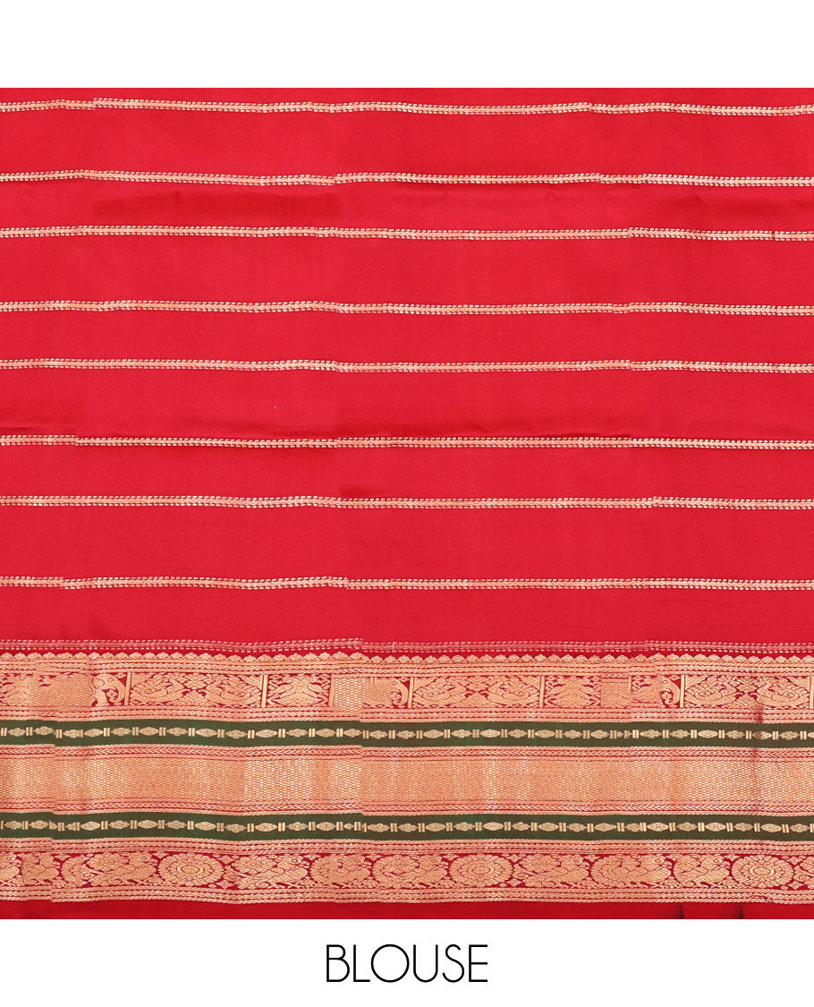 Blue Vasundhara Silk Saree, Accentuated with Zari Buttas and Stripes All Over Its Body, Complemented by a Contrast Border of Elephant, Mayil, and Chakram Designs, a Grand Pallu, and Paired with a Contrast Blouse
