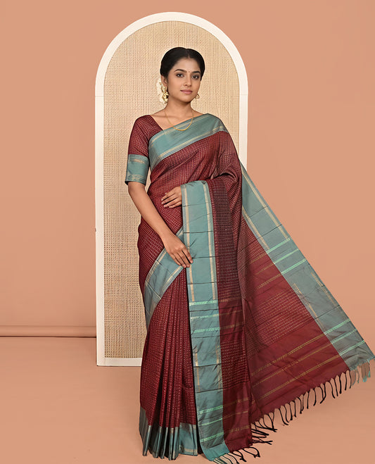 Maroon Aarani Silk Saree, Enriched with Butta Enclosed Checked Design on Its Body, Complemented by a Contrast Zari Striped Border, Pallu of Butta Enclosed Checks, and Paired with a Matching Blouse