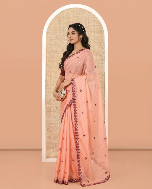 Peach Rangoli Chiffon Saree, Adorned with Thread and Mirror Work Buttas on Its Body, Subtle Scallop Embroidered Border, Embroidered Pallu, and Paired with a Contrast Mirror Work Blouse