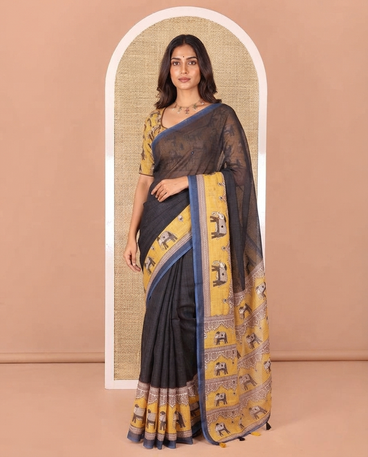 Black Linen Cotton Saree, Gleamed up with Mirror Work On Its Body, Complemented by Contrast Elephant Motifs Printed Border, Pallu Steeped with Elephant Motifs Print, and Paired with a Contrast Blouse