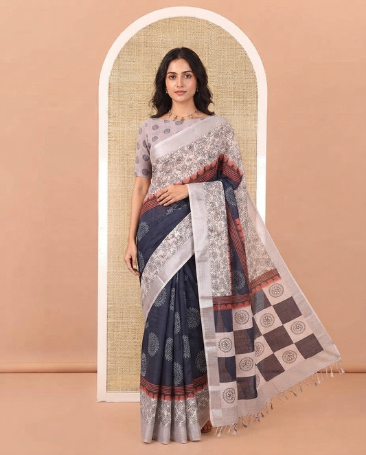 Blue Linen Cotton Saree, Beautified with Rangoli Motifs Printed On Its Body, Complemented by Contrast Floral Printed Border,  Pallu of Butta Enclosed Checks, and Paired with a Contrast Blouse