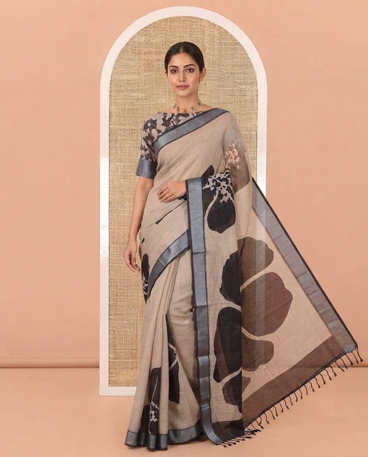 Chikku Linen Cotton Saree, Beautified with Big Floral Prints On Its Body, Complemented by Contrast Zari Bavanji Border, Floral Printed Pallu, and Paired with a Hand Block Printed Blouse