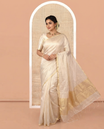 Borderless Off-white Tissue Saree, Steeped with Thin Vertical Zari Stripes All Over Its Body, Highlighted by Gleaming Zari Striped Pallu, and Paired with a Matching Blouse