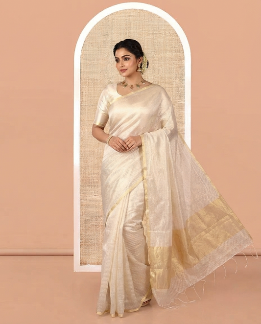 Borderless Off-white Tissue Saree, Steeped with Thin Vertical Zari Stripes All Over Its Body, Highlighted by Gleaming Zari Striped Pallu, and Paired with a Matching Blouse