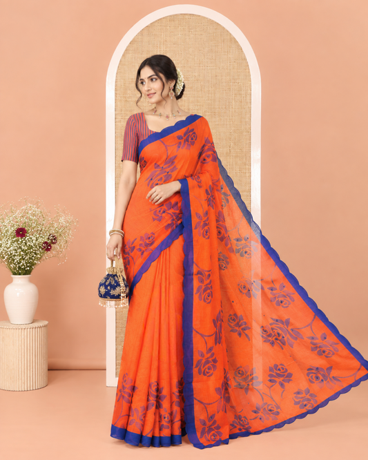 Orange Linen Cotton Saree, Graced with Floral Print and Mirror Work on Its Body, Complemented by Contrast Scallop Border, Pallu of Print and Mirror Work, and Paired with a Matching Blouse