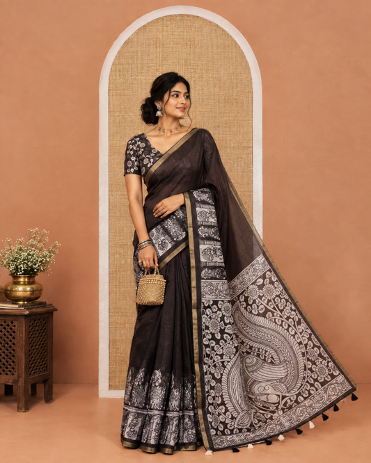 Black Chanderi Cotton Saree, Detailed with Kalamkari-Style Ancient Human Figurines Printed on Its Body, Subtle Zari Piping Border, Pallu Depicting Kalamkari Peacocks, and Paired with a Matching Blouse