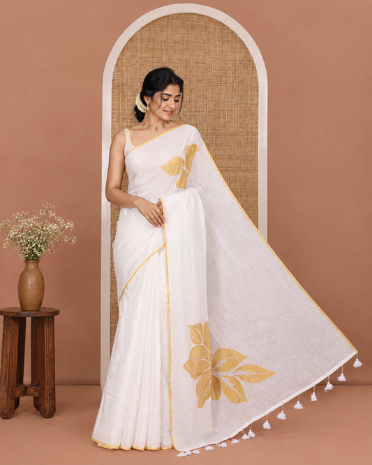 Borderless White Khadi Mul Cotton Saree, Enthralled with Big Hibiscus Floral Motifs Foil-Printed on Its Body, Subtly Sparkled Pallu of the Same Print and Tassels, and Paired with a Matching Blouse