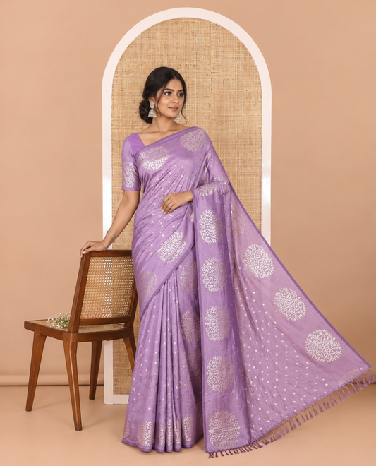Lavender plus buttas woven Vichitra silk saree, kalpavriksha tree motifs woven on its border, self-pallu, and no blouse