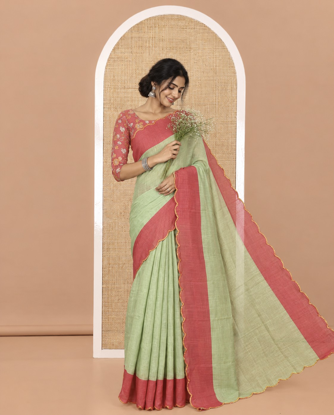 Green Plain Linen Cotton Saree, Complemented by Contrast Scallop Border, Plain Pallu, and Paired with a Contrast Floral Printed Mirror Embroidered Blouse