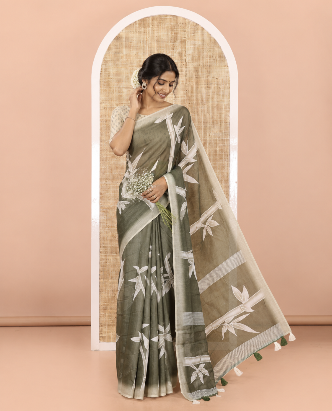 Olive green bamboo motifs printed chanderi cotton saree, contrast plain border, bamboo motifs printed pallu, and a contrast unique motifs printed blouse