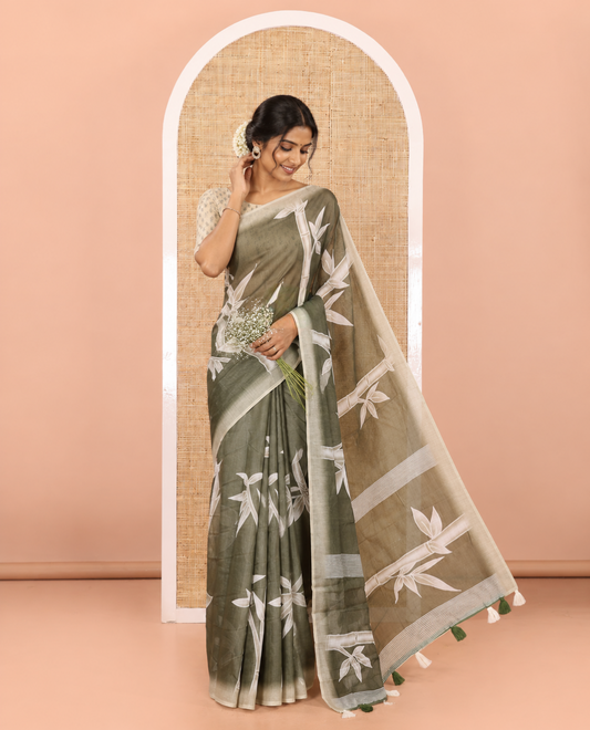 Olive green bamboo motifs printed chanderi cotton saree, contrast plain border, bamboo motifs printed pallu, and a contrast unique motifs printed blouse