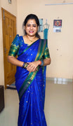 Royal Blue Softy Silk Saree, Accentuated with Zari Buttas, Contrast Traditional Rettai Pettu Border, Pallu of Buttas, and a Matching Blouse