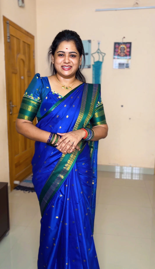 Royal Blue Softy Silk Saree, Accentuated with Zari Buttas, Contrast Traditional Rettai Pettu Border, Pallu of Buttas, and a Matching Blouse