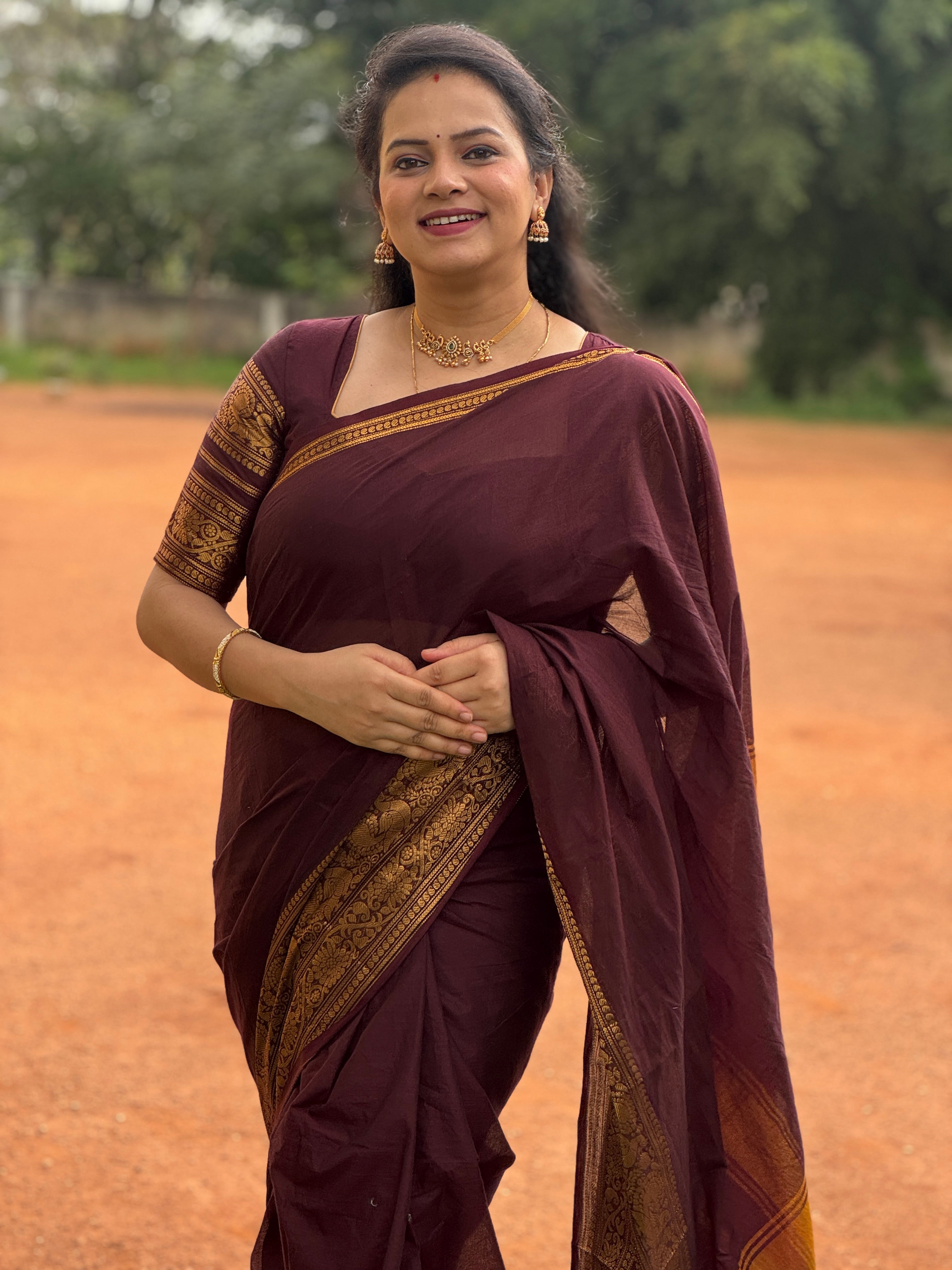 Maroon Plain Chettinad Cotton Saree, Highlighted by a Traditional Zari Border, Striped Pallu, and a Matching Blouse