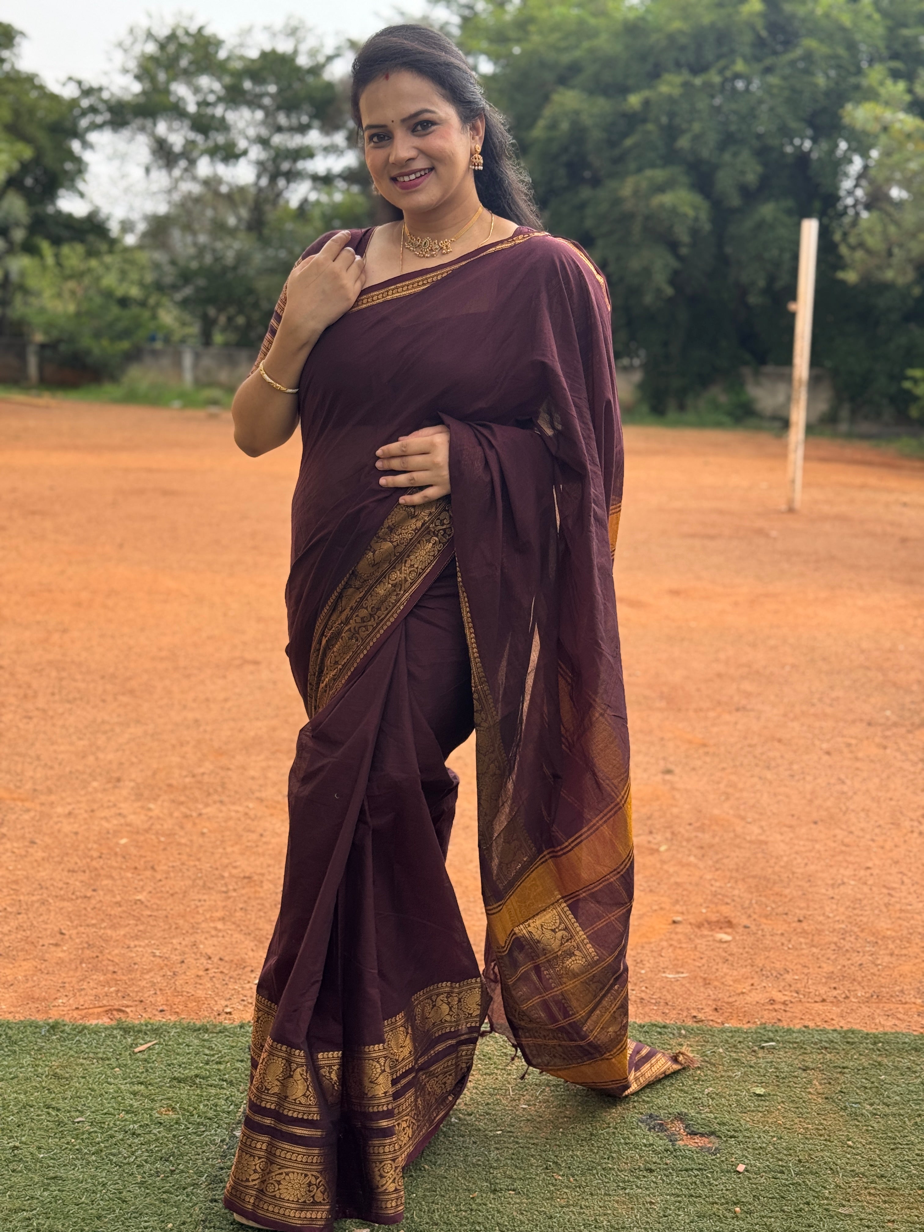 Maroon Plain Chettinad Cotton Saree, Highlighted by a Traditional Zari Border, Striped Pallu, and a Matching Blouse
