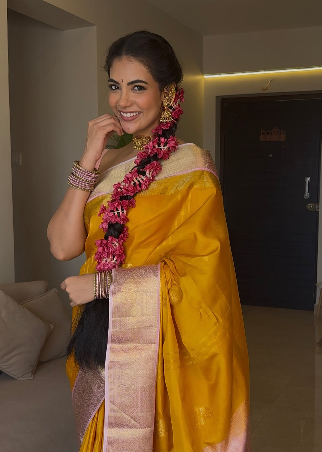 Mustard Yellow-Beach Pink Vasundhara Silk Saree Features Zari Buttas, Contrast Border of Cross Kamalam, Rudraksham, and Thilakam, Grand Pallu, and a Contrast Blouse