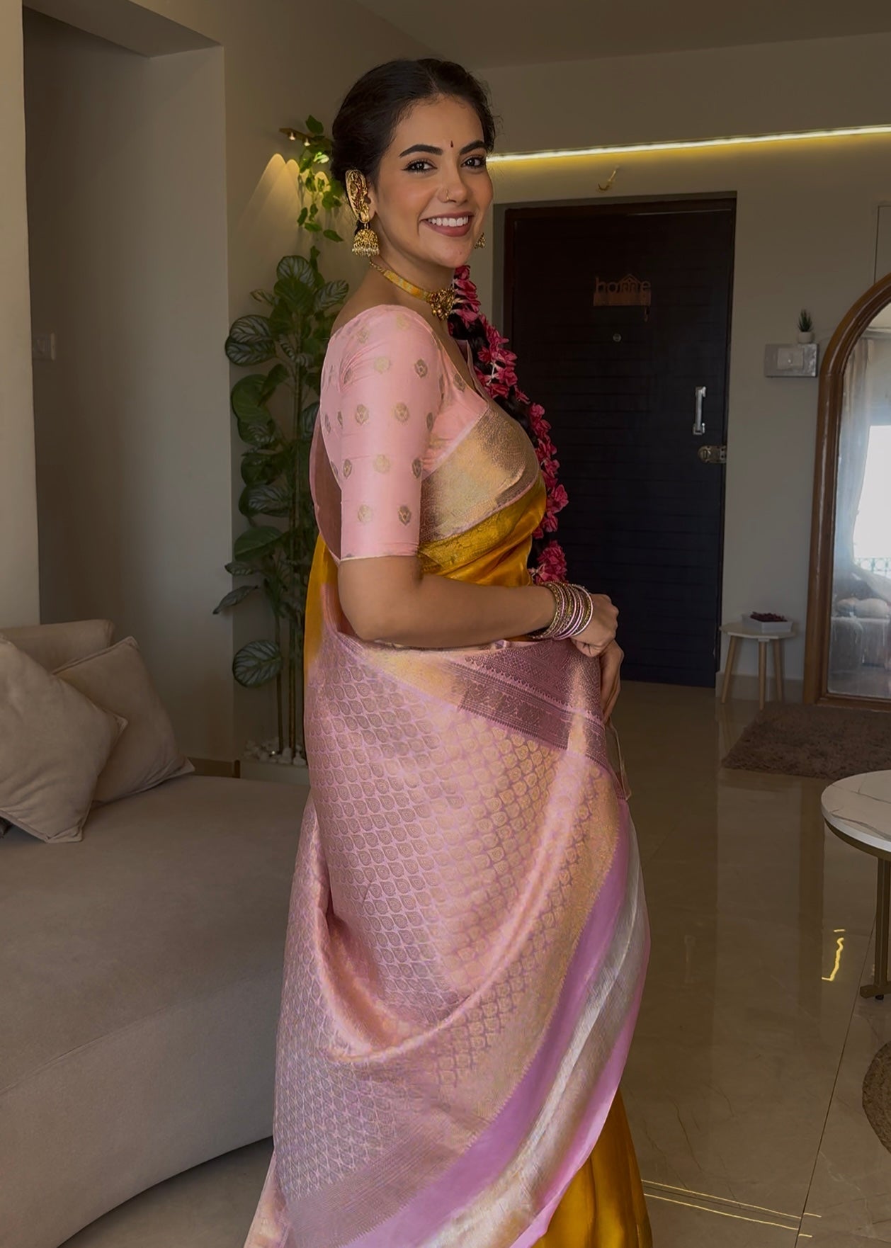 Mustard Yellow-Beach Pink Vasundhara Silk Saree Features Zari Buttas, Contrast Border of Cross Kamalam, Rudraksham, and Thilakam, Grand Pallu, and a Contrast Blouse