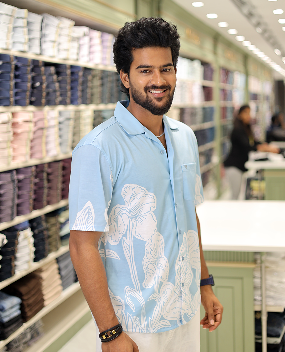 Blue Cotton-Blended Casual Shirt, Adorned with a Floral-Swan Print, Half-Sleeves, Spread Collar, Regular Fit, and Regular Length 