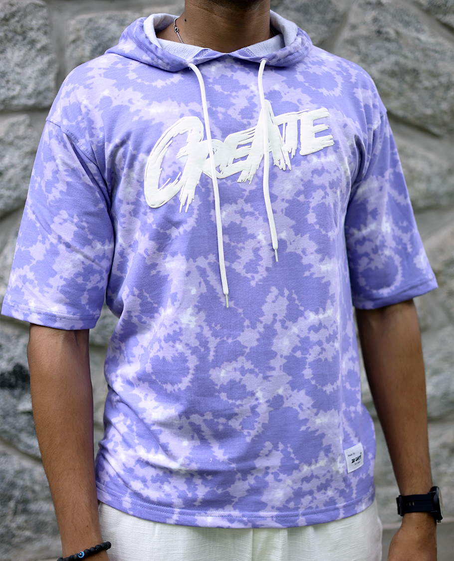 Lilac Cotton-Blended Oversized Hooded T-Shirt Features Abstract Dyed Typography Print, Half-Sleeves, and Regular Length