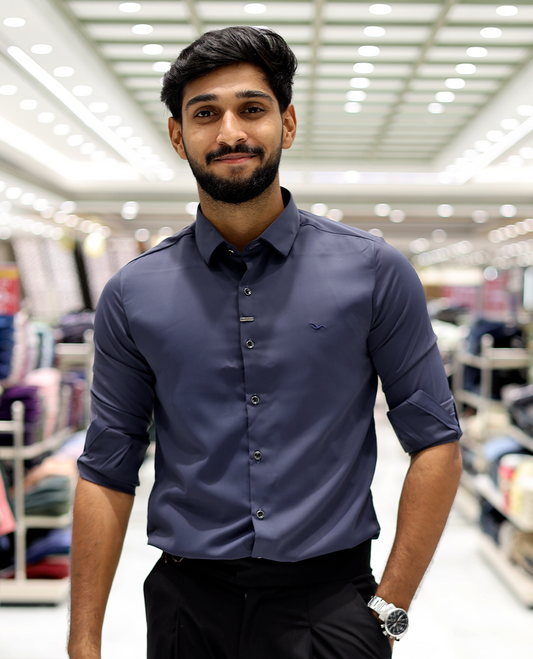 Blue Solid Poly-Blended Formal Shirt Features Full Sleeves, a Slim Fit, a Spread Collar, and Regular Length