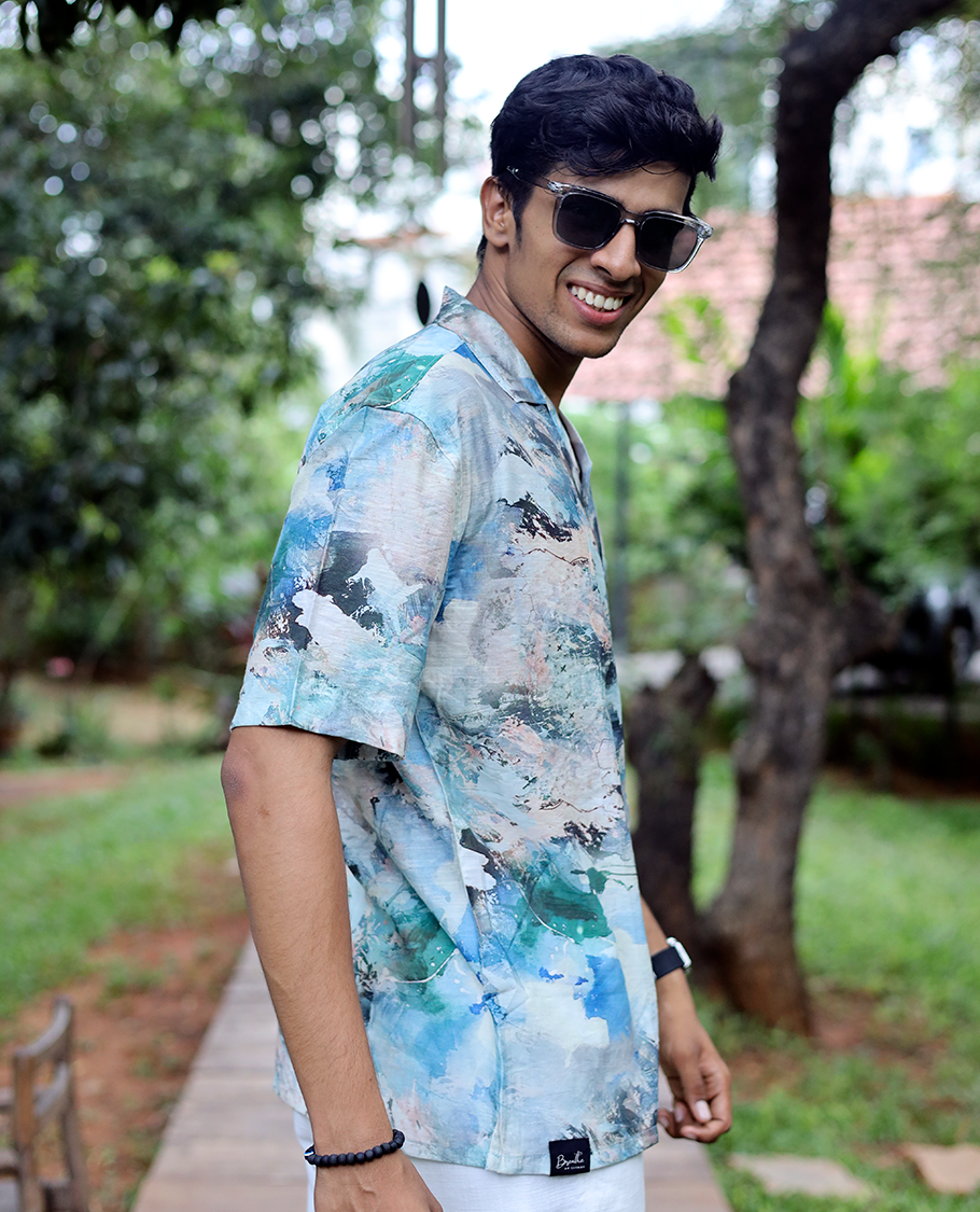 Blue Cotton-Blended Casual Shirt Elevated with Abstract-Painting-Style Print, Half Sleeves, a Regular Fit, a Cuban Collar, and a Regular Length