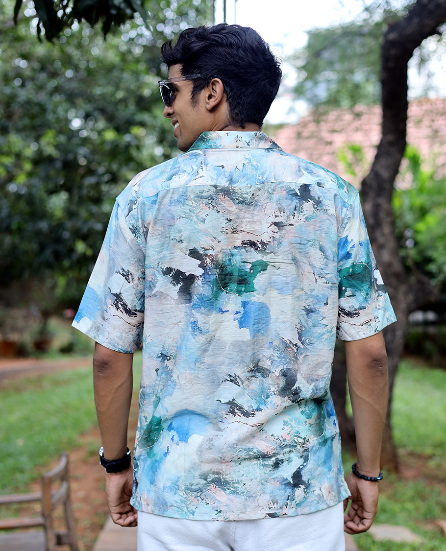 Blue Cotton-Blended Casual Shirt Elevated with Abstract-Painting-Style Print, Half Sleeves, a Regular Fit, a Cuban Collar, and a Regular Length